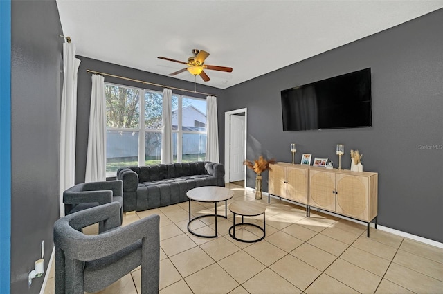 tiled living room featuring ceiling fan