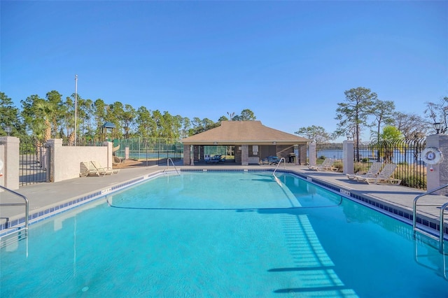 view of swimming pool with a patio area