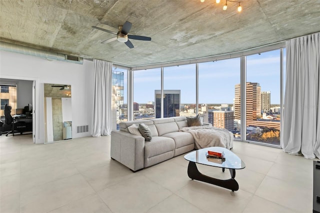 living room featuring plenty of natural light, ceiling fan, and floor to ceiling windows