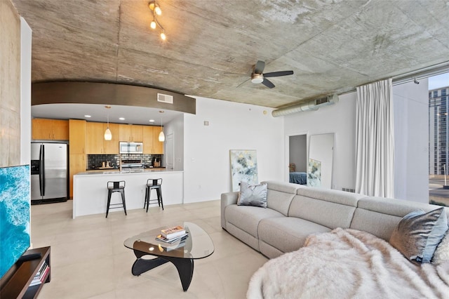 living room featuring ceiling fan