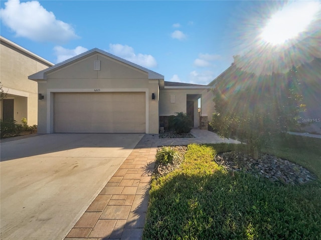 view of front of property featuring a garage and a front lawn