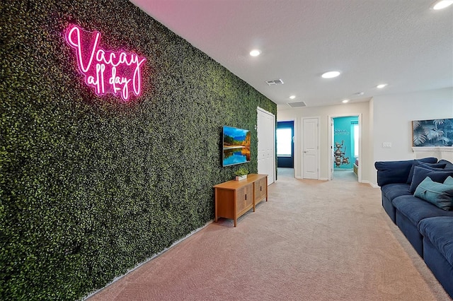 living room with carpet flooring and a textured ceiling