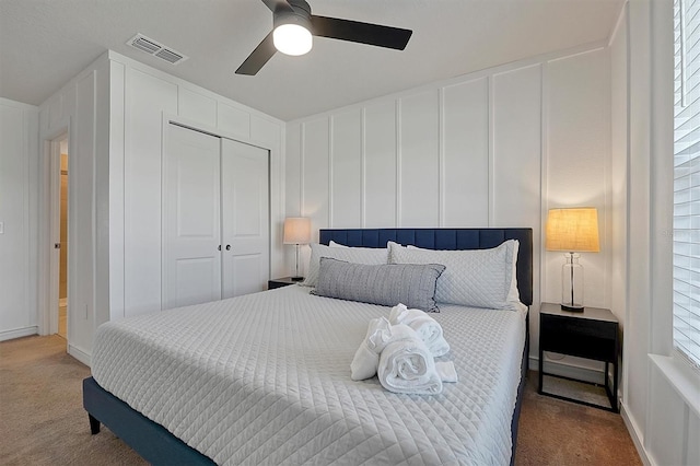 bedroom featuring carpet flooring, ceiling fan, and a closet