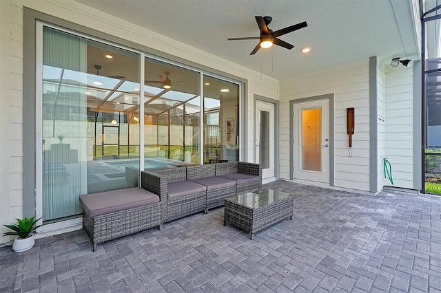 view of patio with ceiling fan and an outdoor hangout area