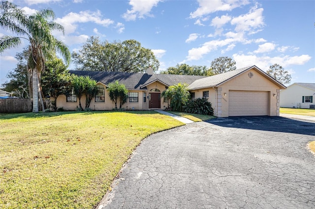 ranch-style house with a front yard and a garage