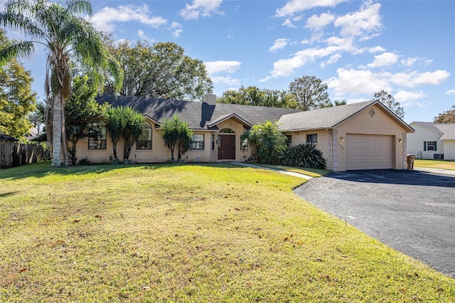 ranch-style house with a garage and a front lawn