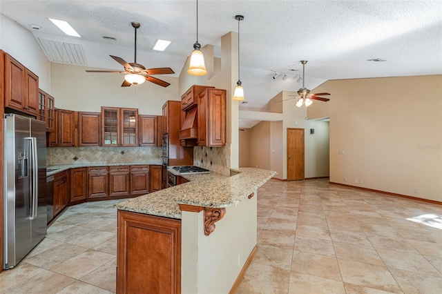 kitchen with tasteful backsplash, stainless steel fridge with ice dispenser, light stone counters, kitchen peninsula, and a kitchen bar