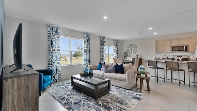 living room featuring light tile patterned flooring