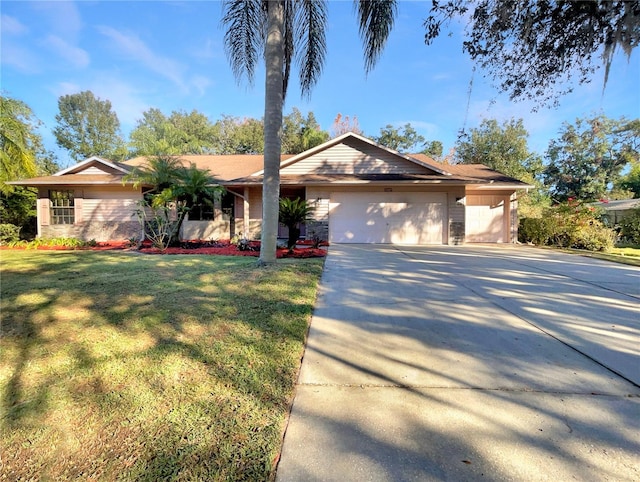 view of front of property with a garage and a front yard