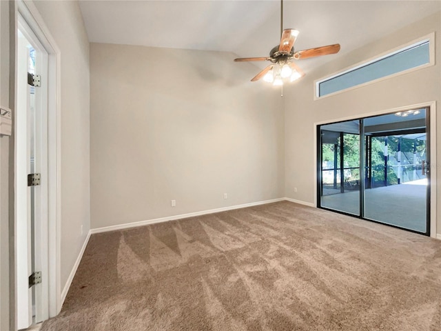 unfurnished room featuring carpet, ceiling fan, and lofted ceiling