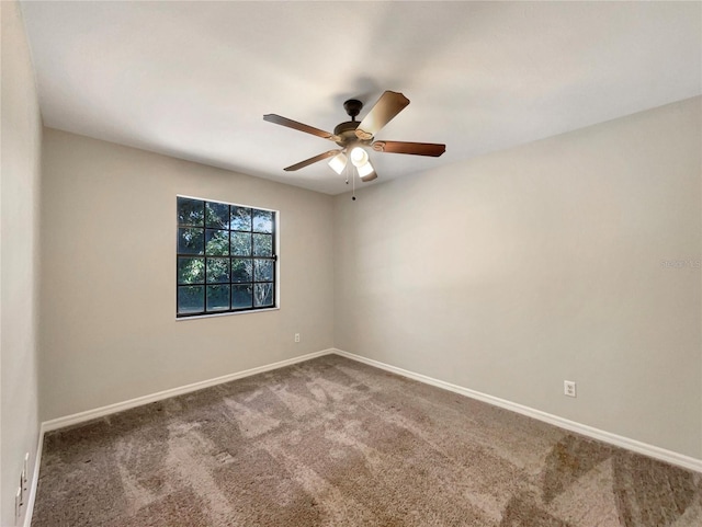 unfurnished room with ceiling fan and carpet floors