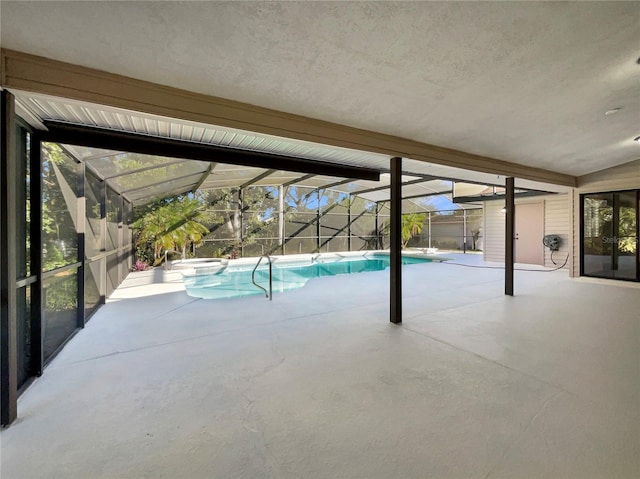 view of swimming pool with a lanai and a patio area