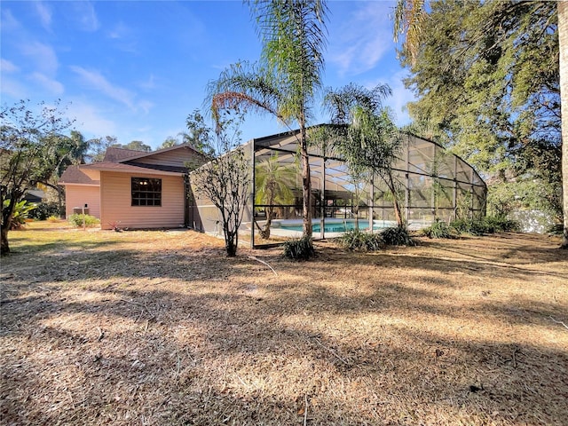 view of yard featuring glass enclosure