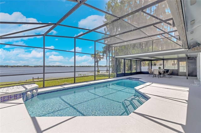 view of swimming pool with a lanai, a patio area, and a water view