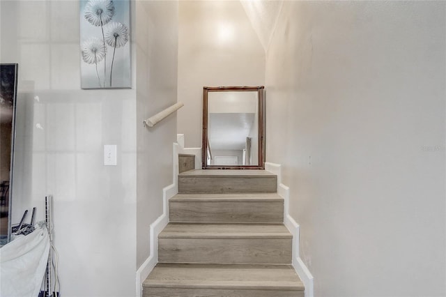 stairway featuring hardwood / wood-style floors