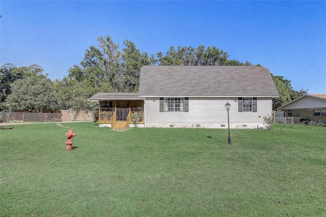 exterior space with crawl space, a front yard, and fence