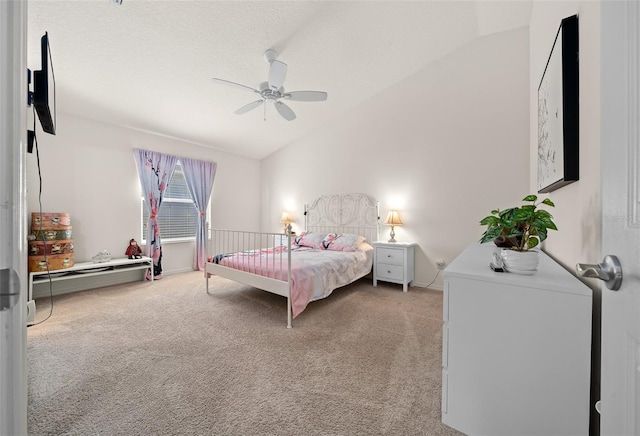 carpeted bedroom featuring ceiling fan, a textured ceiling, and vaulted ceiling