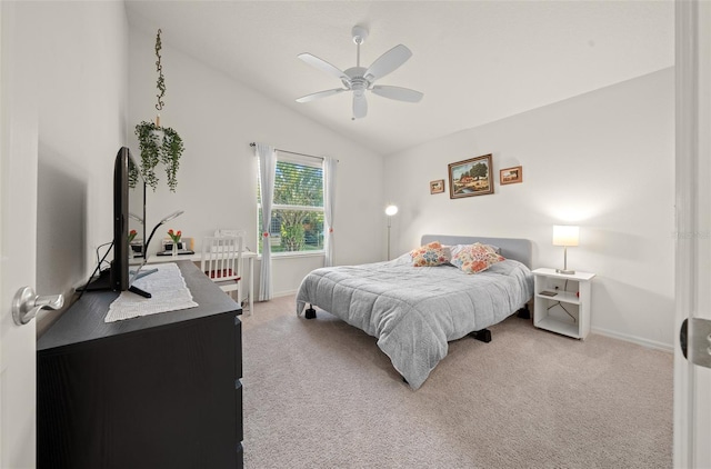 bedroom featuring light carpet, ceiling fan, and vaulted ceiling