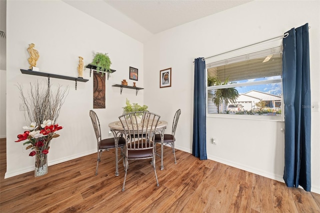 dining room with hardwood / wood-style floors