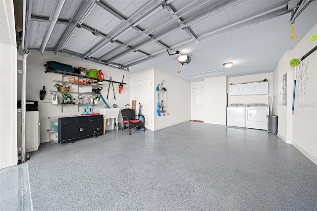 garage featuring a garage door opener and washing machine and clothes dryer