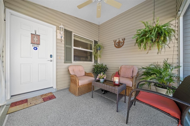 view of exterior entry with covered porch and ceiling fan