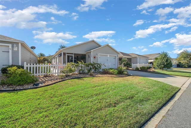 view of front of house with a front yard and a garage