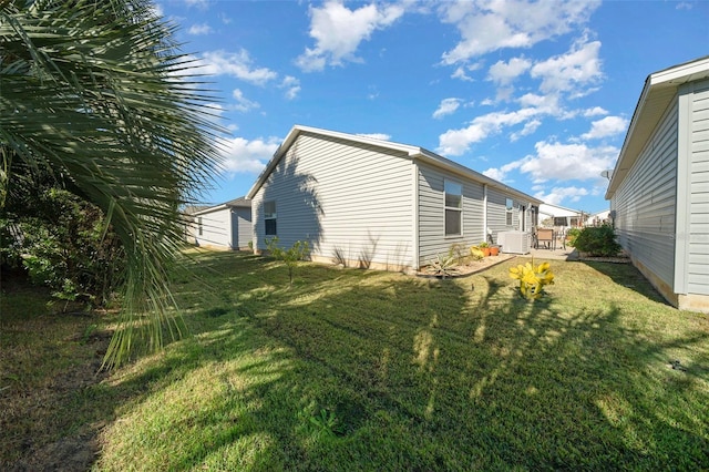 view of property exterior with a lawn