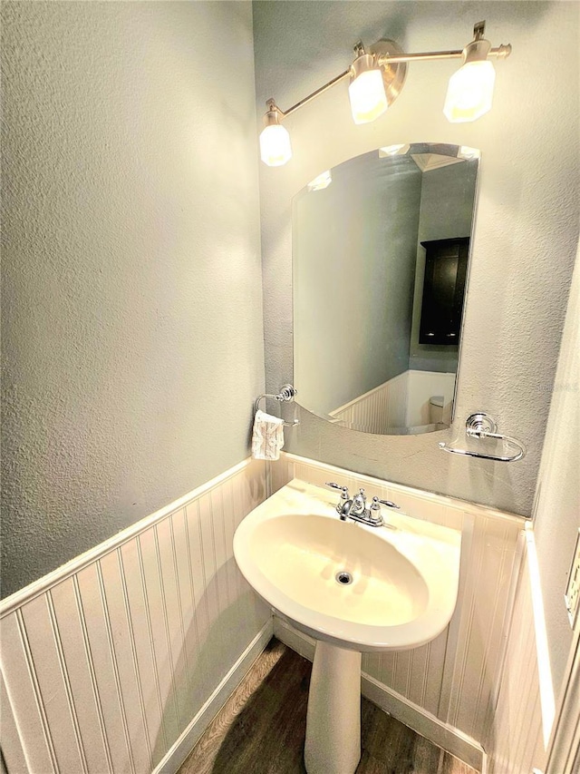 bathroom featuring sink and hardwood / wood-style flooring