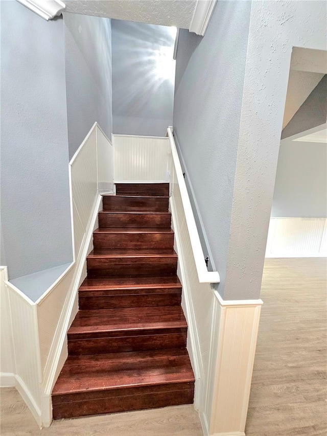 staircase featuring hardwood / wood-style flooring