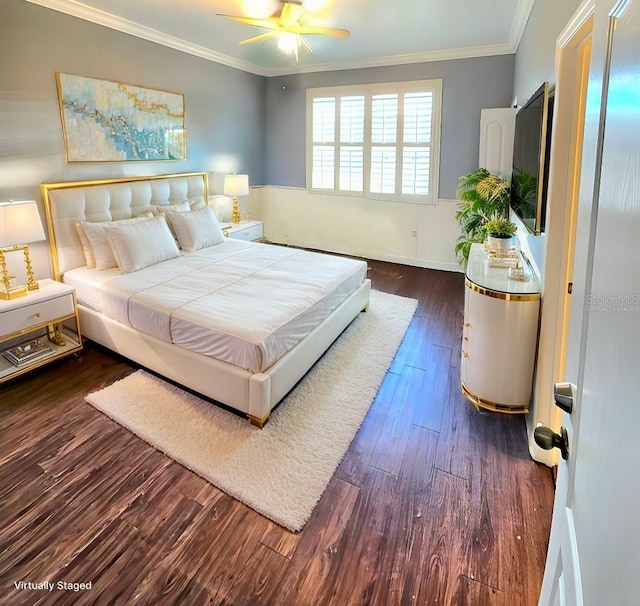 bedroom with dark hardwood / wood-style floors, ceiling fan, and crown molding