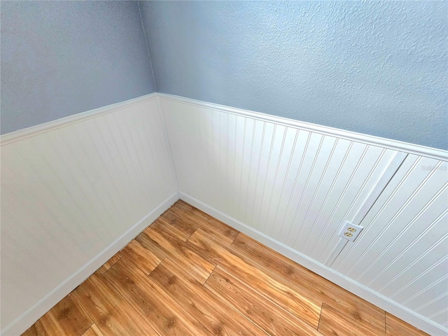 spare room featuring wood-type flooring