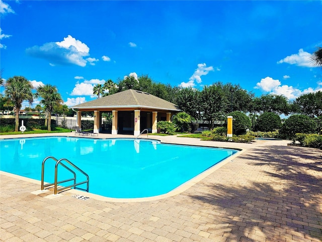 view of pool featuring a gazebo and a patio