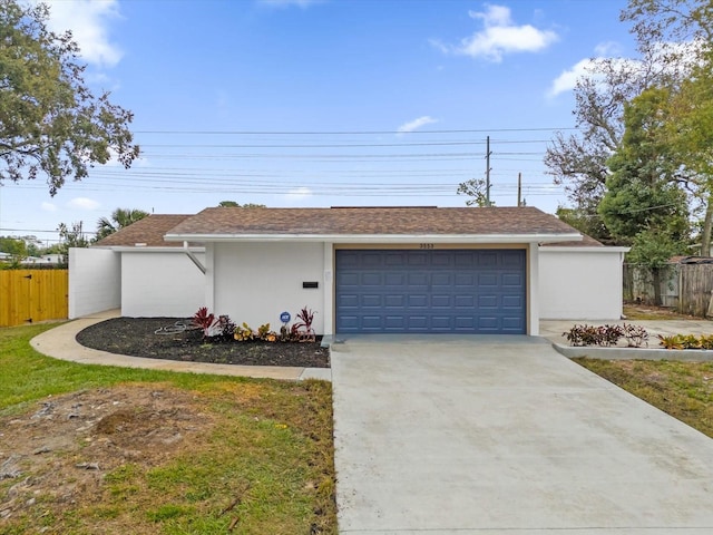 ranch-style home featuring a garage