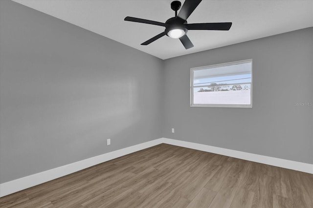 unfurnished room featuring ceiling fan and light wood-type flooring