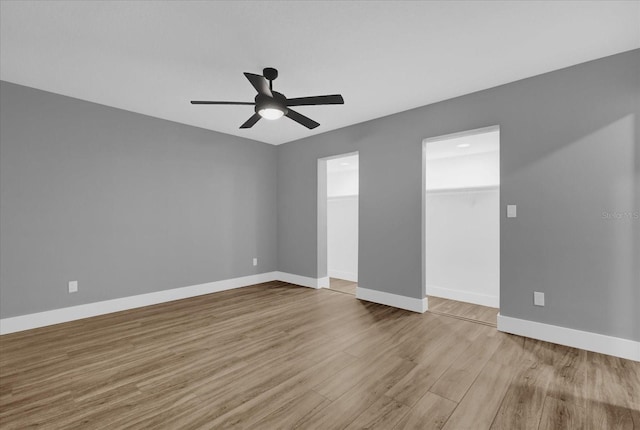 unfurnished room featuring ceiling fan and light hardwood / wood-style flooring