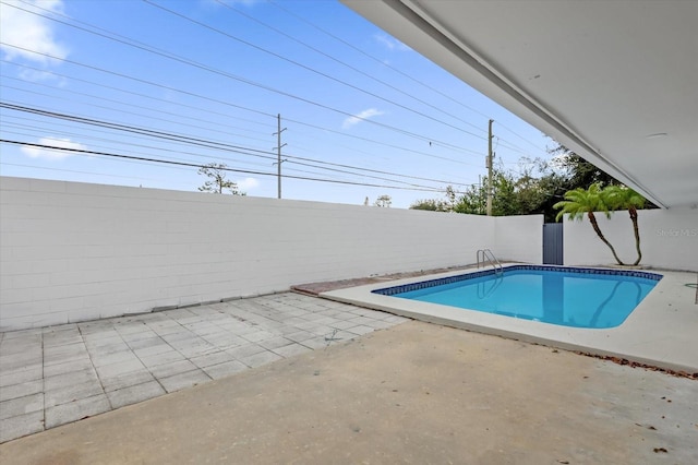 view of swimming pool featuring a patio