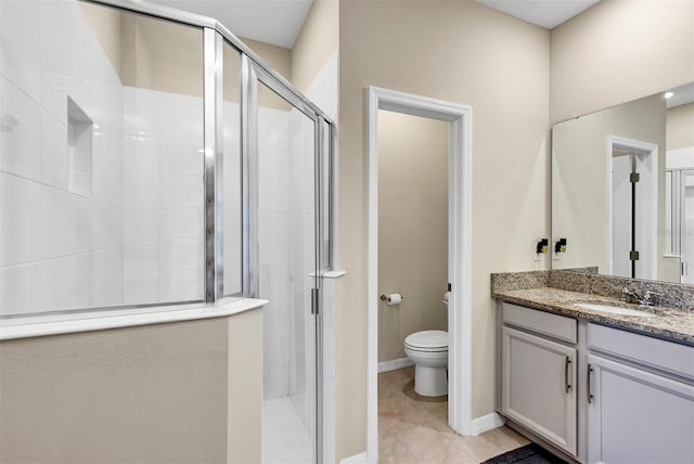 bathroom with vanity, toilet, and walk in shower