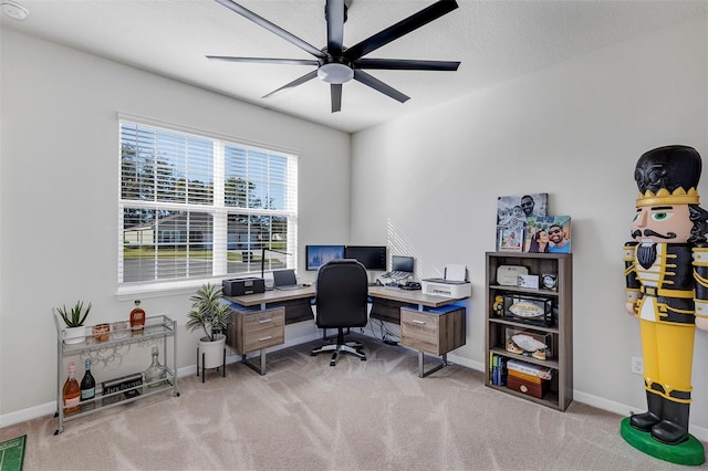 office area with light carpet, a textured ceiling, and ceiling fan