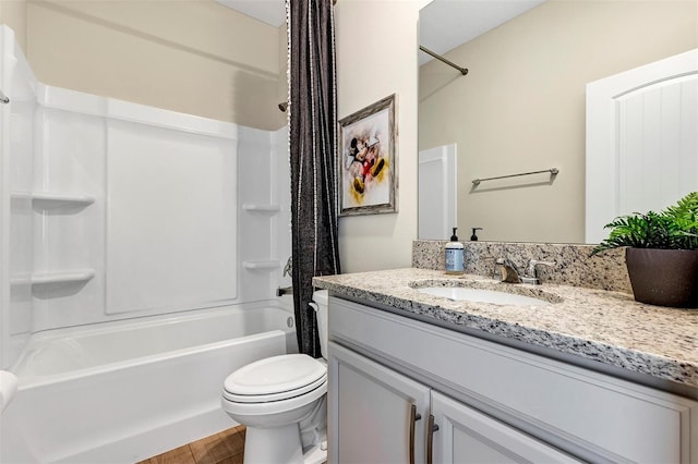 full bathroom featuring vanity,  shower combination, toilet, and wood-type flooring