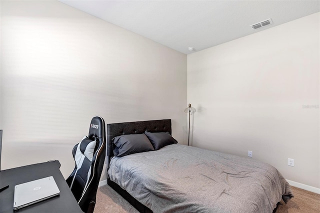 bedroom with light colored carpet