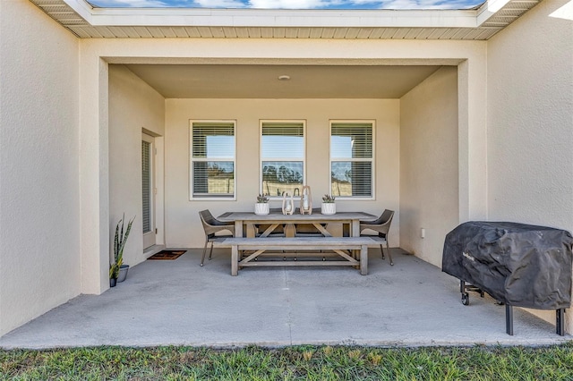 view of patio with a grill