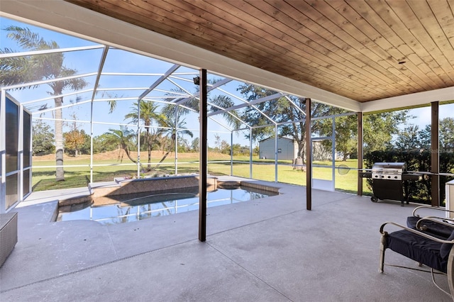 view of swimming pool with a patio, area for grilling, a lanai, a jacuzzi, and a yard