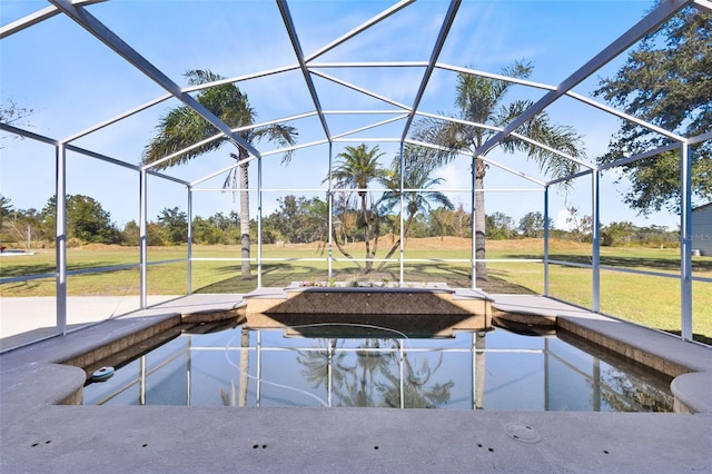 view of swimming pool with a yard and glass enclosure