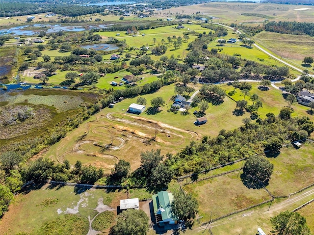 drone / aerial view with a rural view and a water view