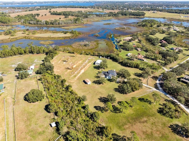 aerial view with a rural view and a water view