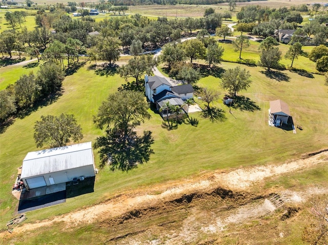 birds eye view of property featuring a rural view