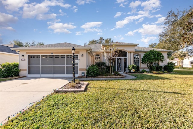 view of front facade with a garage and a front yard