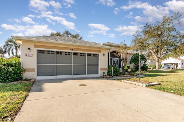 view of front facade featuring a front yard and a garage