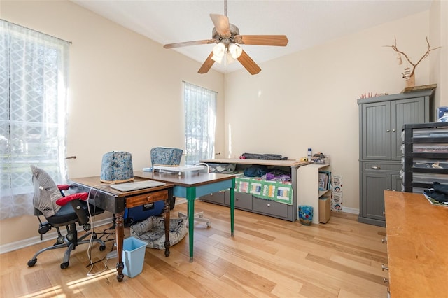 office space with ceiling fan and light wood-type flooring