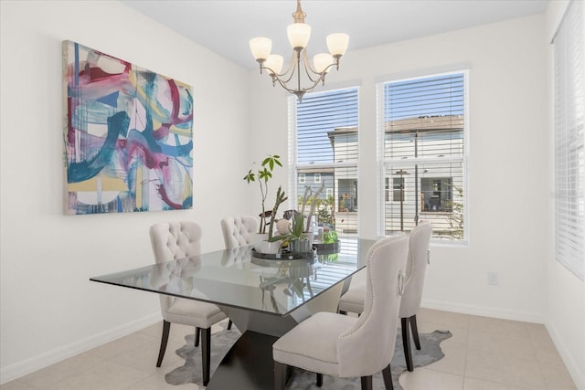 tiled dining space featuring an inviting chandelier